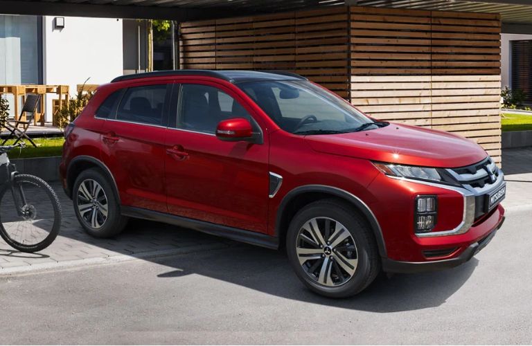 
Front view of the 2023 Mitsubishi RVR driving on road