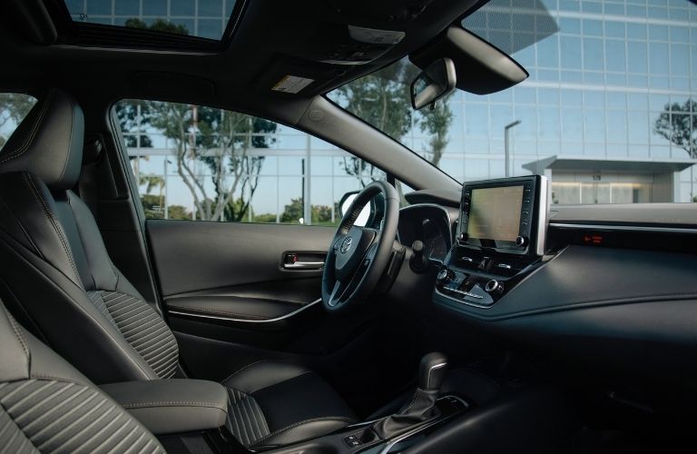 Interior front seating area of the 2022 Toyota Corolla is shown.